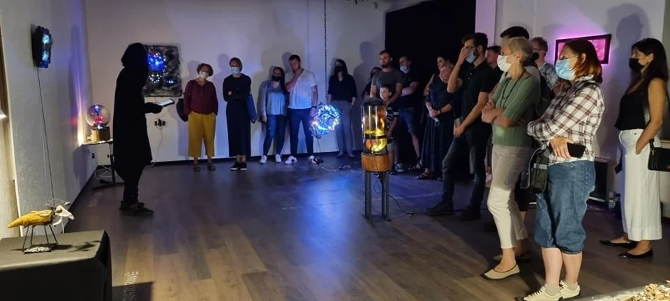 Deus Ex Machina — a night tour of the exhibition, visitors gathered around a glowing installation