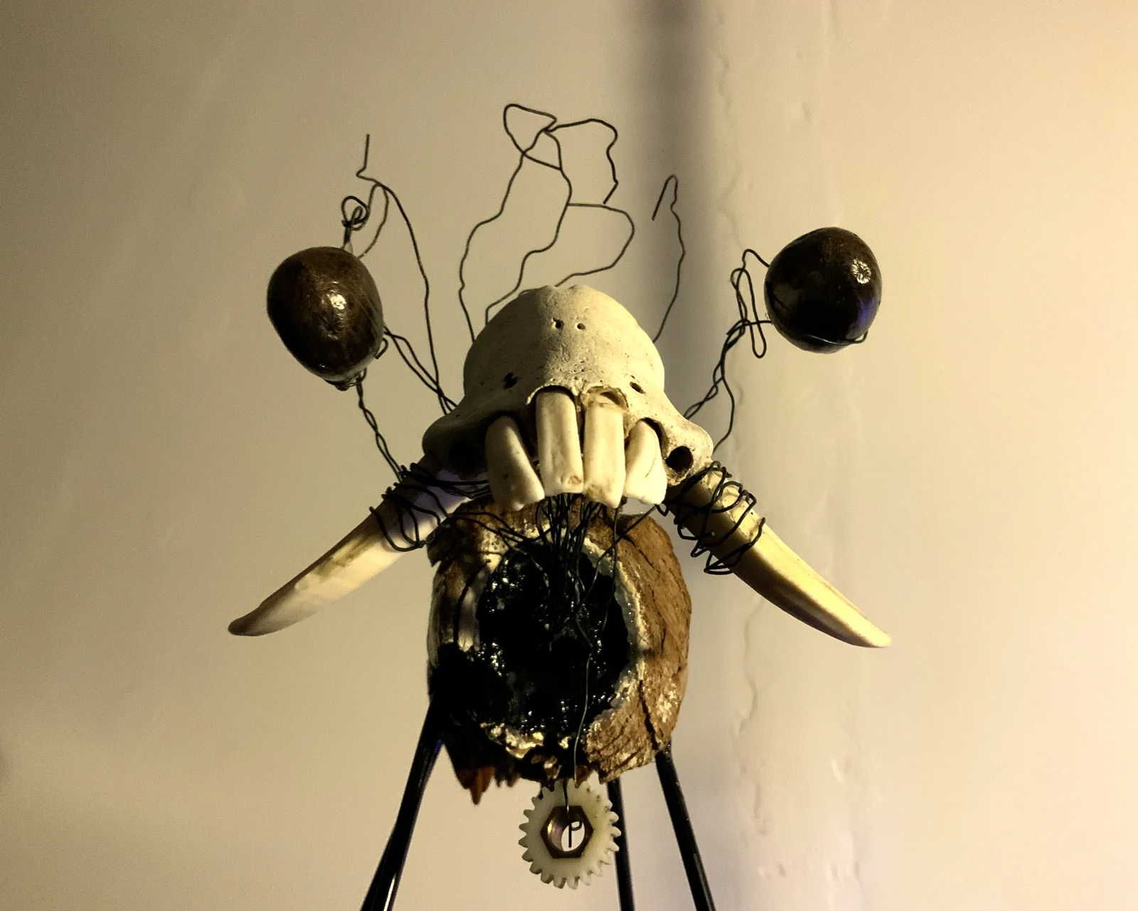 Lab Rat — a horned skull assemblage strung with black wire and dark orbs